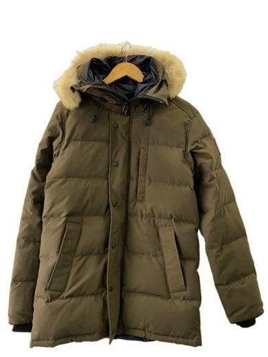 Front view of a brown Canada Goose Carson men's polyester down jacket with fur-trimmed hood hanging on a wooden hanger.