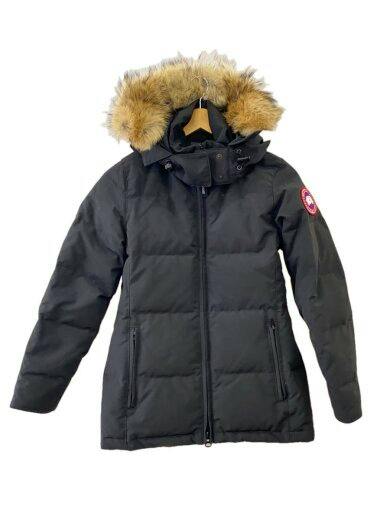 Front view of the black Canada Goose Chelsea parka (men's polyester down jacket) with fur-trimmed hood hanging on a hanger.