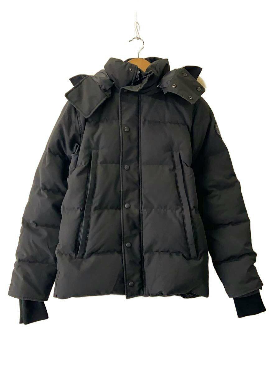 Front view of a black Canada Goose down jacket hanging on a hanger against a white background.
