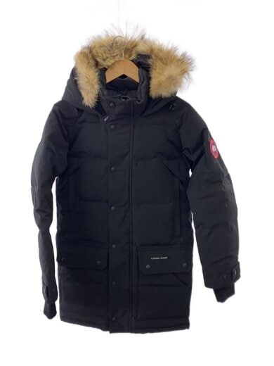 Front view of a black Emory Parka (men's jacket, size XS, polyester) hanging on a hanger, showing the hood with fur trim.