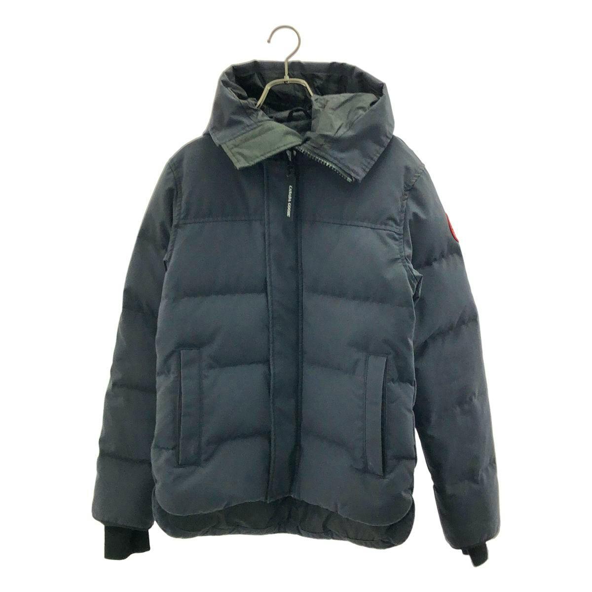 Front view of a black Canada Goose MacMillan parka (men's) hanging on a hanger.