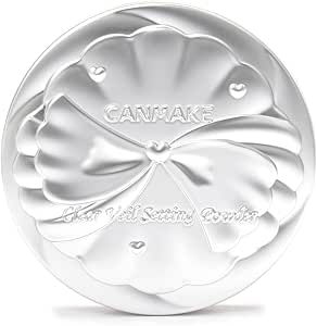 A silver compact case for Canmake face powder embossed with a bow design and the "CANMAKE" logo.