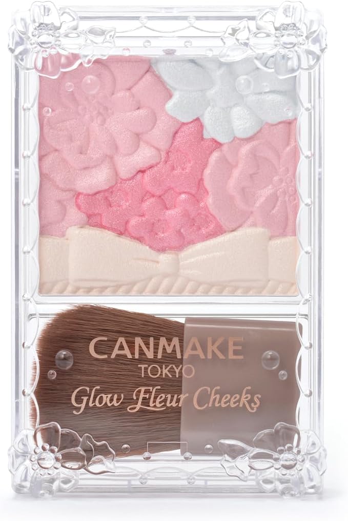 Canmake Glow Fleur Cheeks compact showing floral-embossed cherry-pink powder blush and a small brush in a clear plastic case.