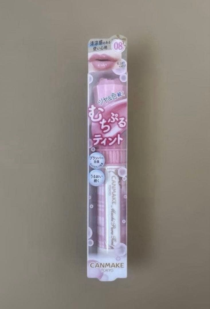 Front view of CANMAKE lip tint (08) in pink retail packaging showing the product tube and branding.