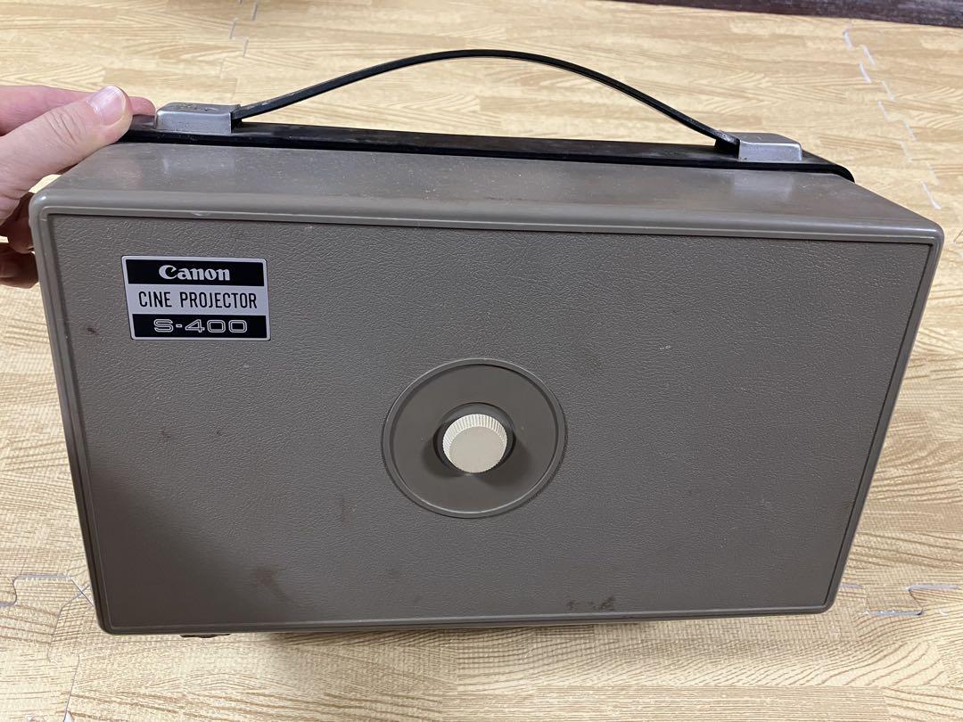Top view of a closed Canon Cine Projector S-400 with carrying handle and model label visible.