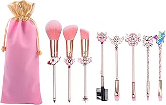 Photo of a makeup brush set showing eight pink-bristled brushes with gold wand-like handles and a pink drawstring pouch.