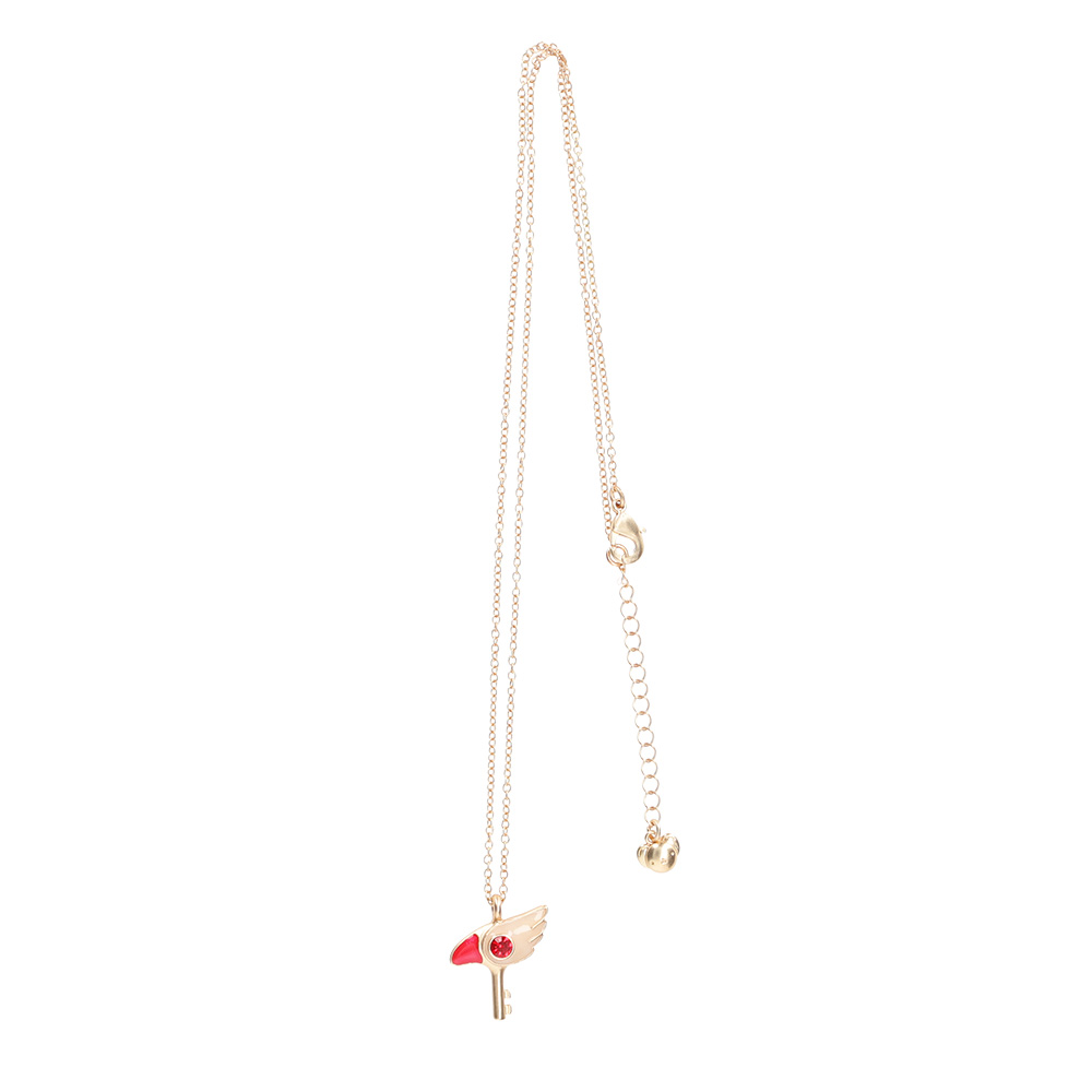 A gold-tone Cardcaptor Sakura sealing key necklace with red enamel detail on a white background.