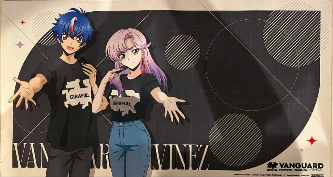Playmat showing two illustrated characters in front of a black geometric background, with GIRAFULL text on their shirts and a VANGUARD logo.