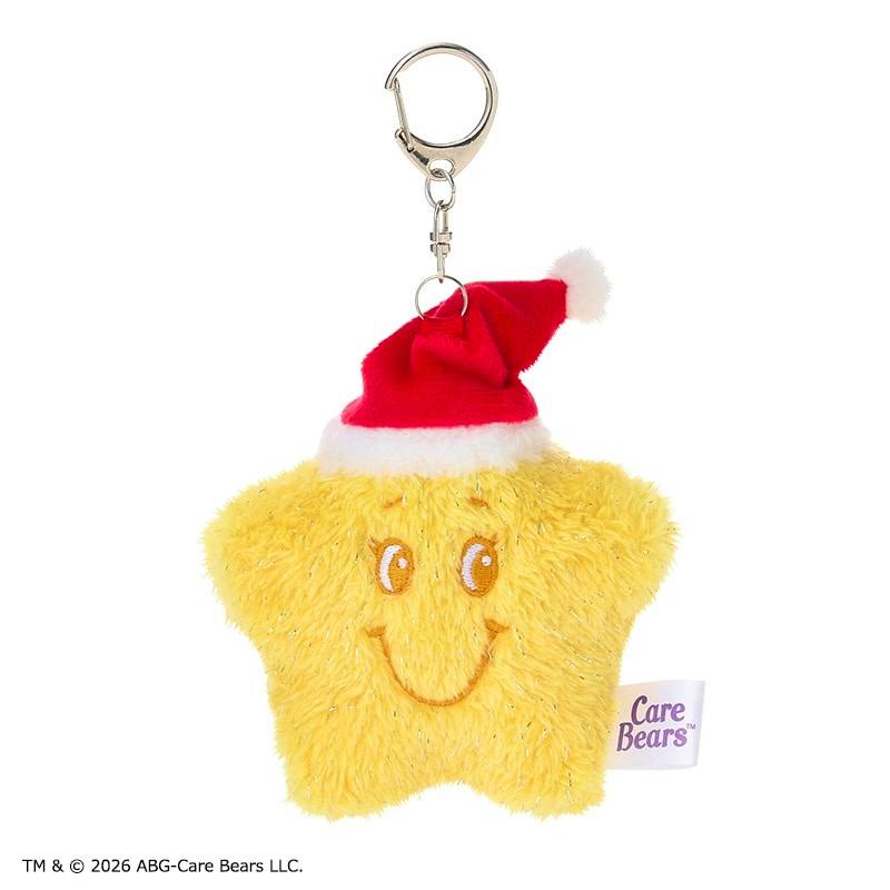 Front view of the Care Bears Christmas star plush keyring (Star Buddy) wearing a red Santa hat with a Care Bears tag visible.
