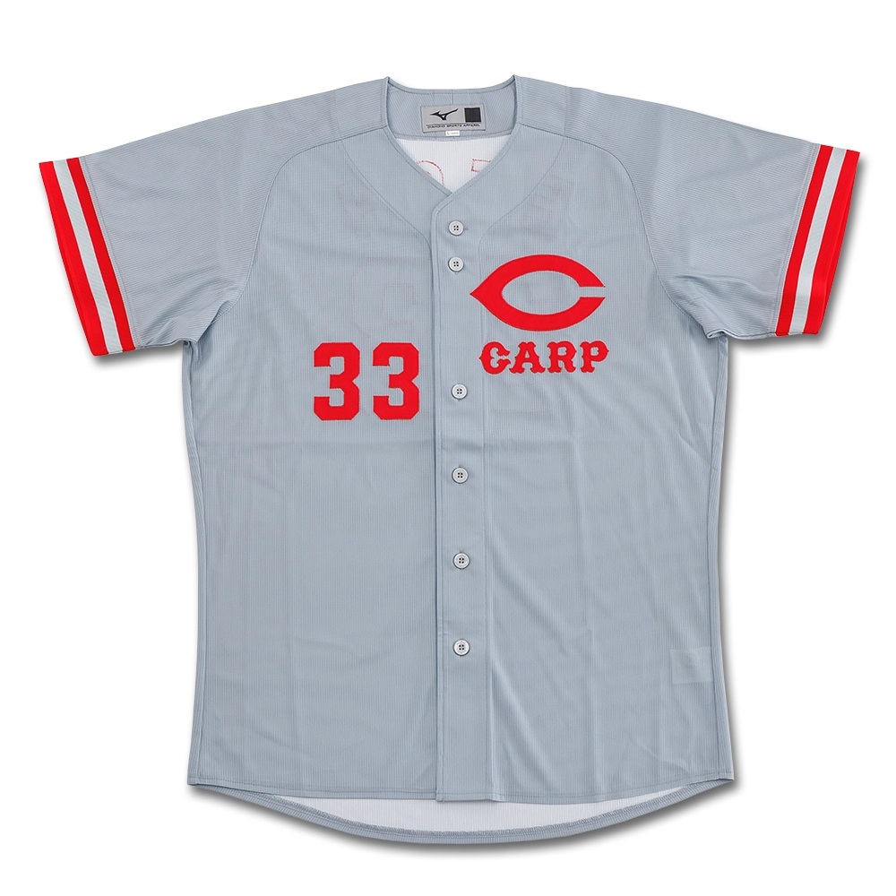 Front view of a gray Carp Legend replica baseball uniform (visitor) showing a red "CARP" logo and the number 33.