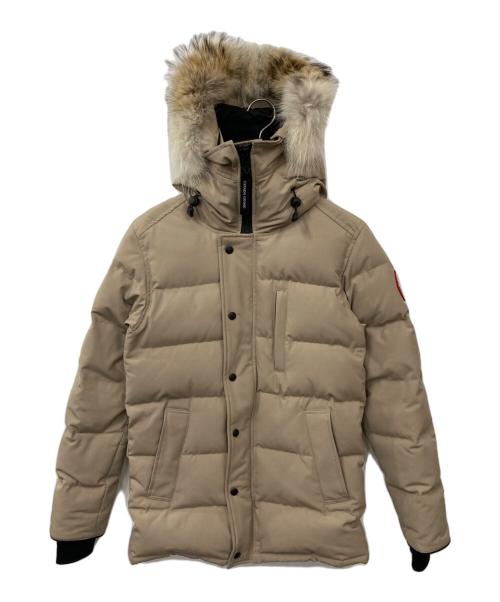 Beige men's CARSON PARKA (polyester) with a fur-trimmed hood displayed on a hanger against a white background.