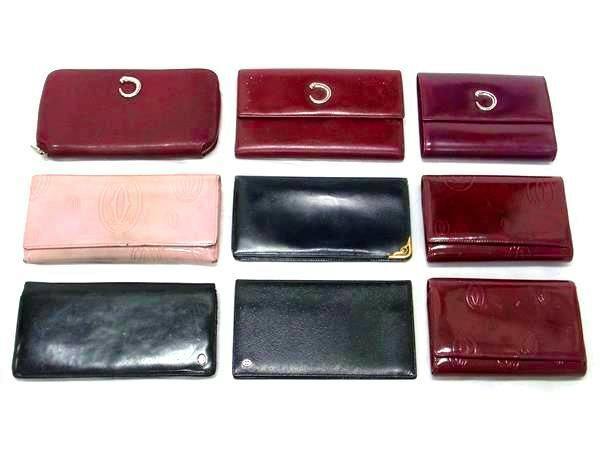Nine Cartier wallets and long wallets arranged in three rows on a white background.