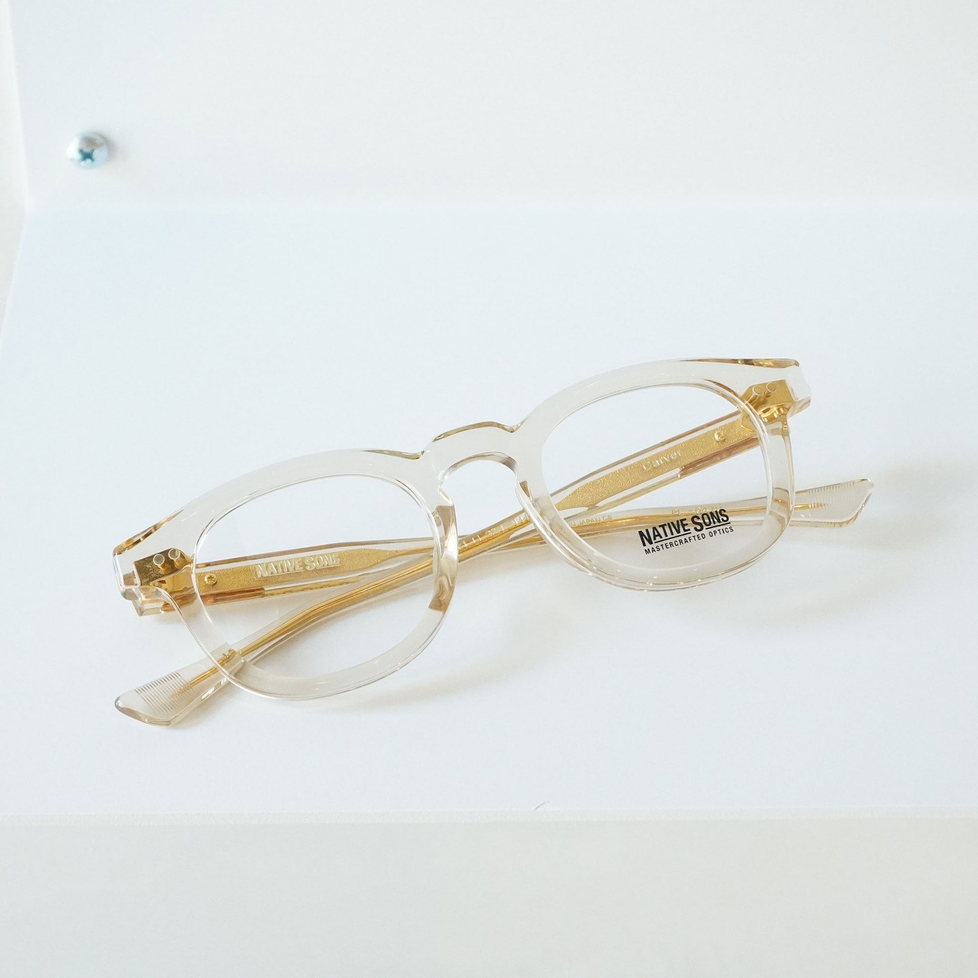 CARVER (HONEY MAUVE) glasses pictured on a white surface with the frame and temples visible.