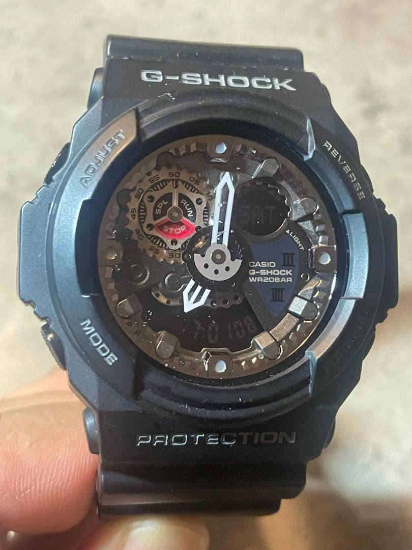 Front close-up of an all-black CASIO G-SHOCK GA-300 analog-digital watch showing the dial and resin band.