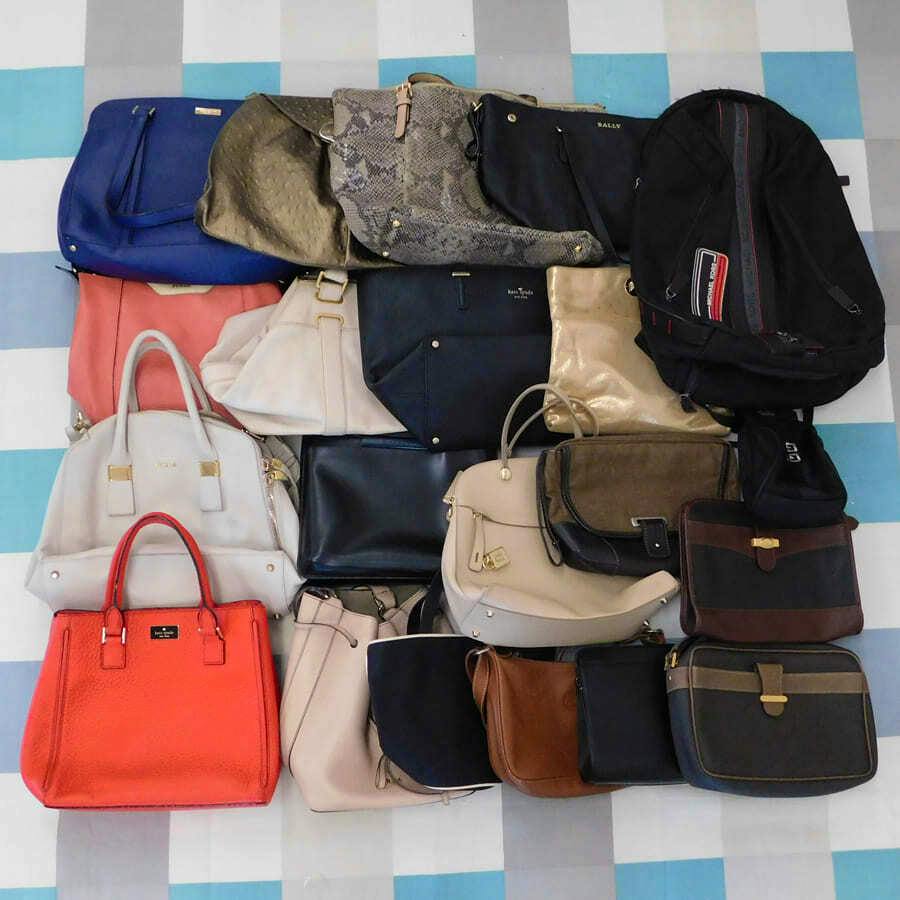 Assorted casual handbags and a backpack arranged together on a checkered background.