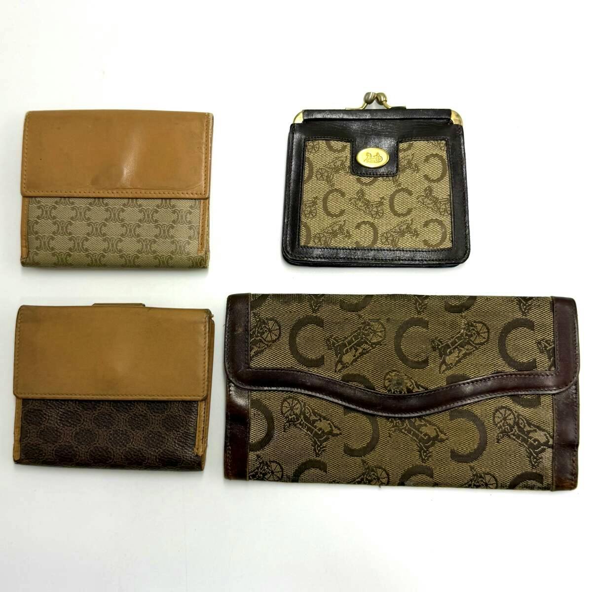 Four brown CELINE wallets and coin cases arranged on a white background.
