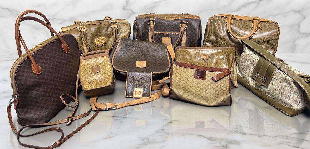 Photo of the CELINE macadam-pattern canvas bag set showing multiple bags and clutches arranged on a marble surface.