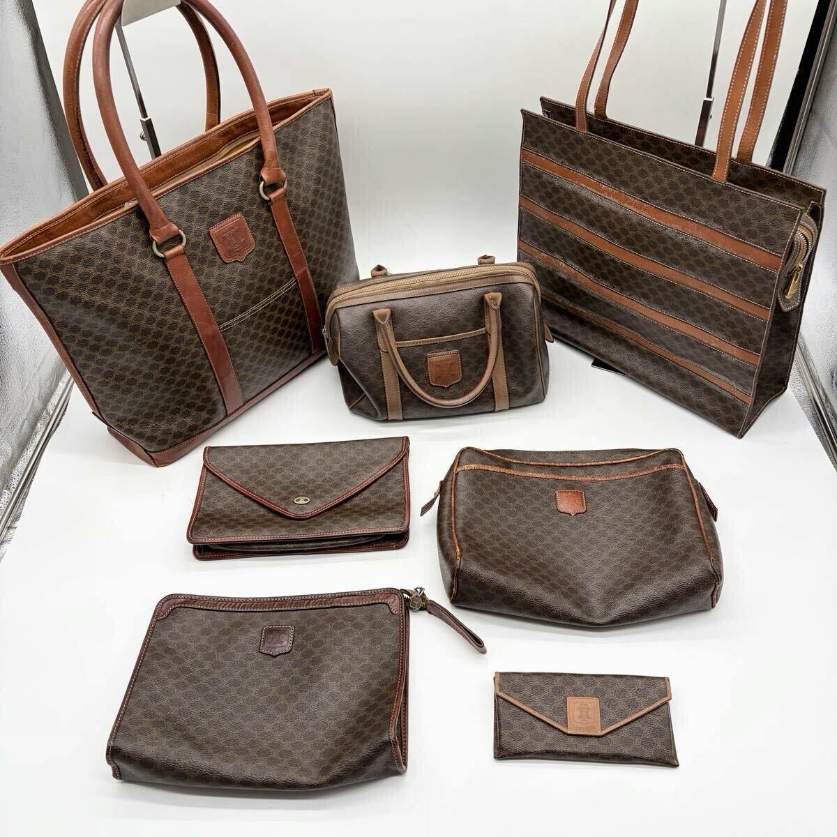 Seven brown CELINE macadam-patterned bags and pouches arranged on a white surface.