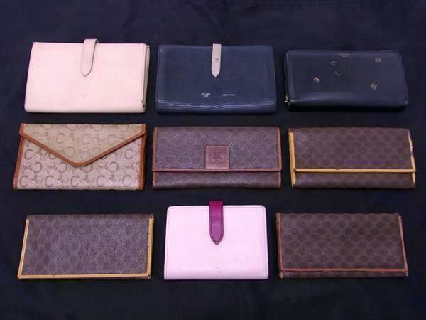 Nine CELINE wallets in various styles and colors arranged on a black background.