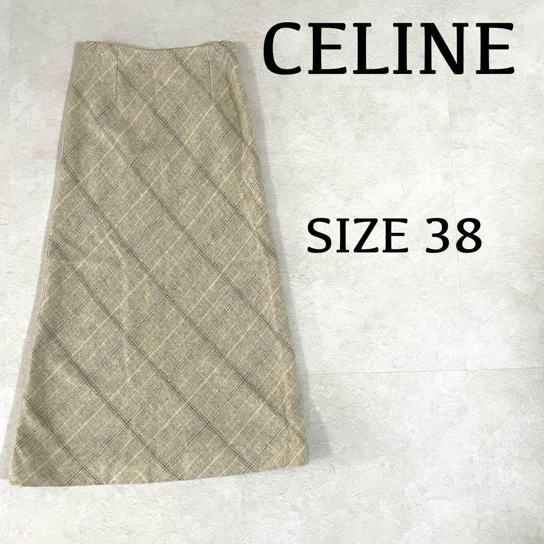 A long beige checked women’s skirt laid flat on a light background with “CELINE” and “SIZE 38” text overlay.