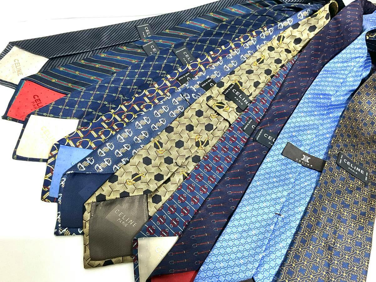 Ten CELINE silk neckties fanned out on a white background showing various patterns and CELINE labels.