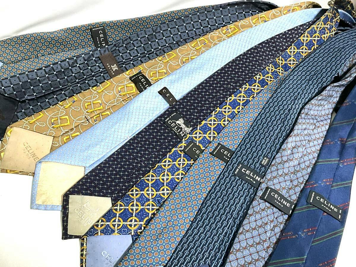 A fanned arrangement of CELINE silk neckties in various patterns and colors with visible CELINE labels.