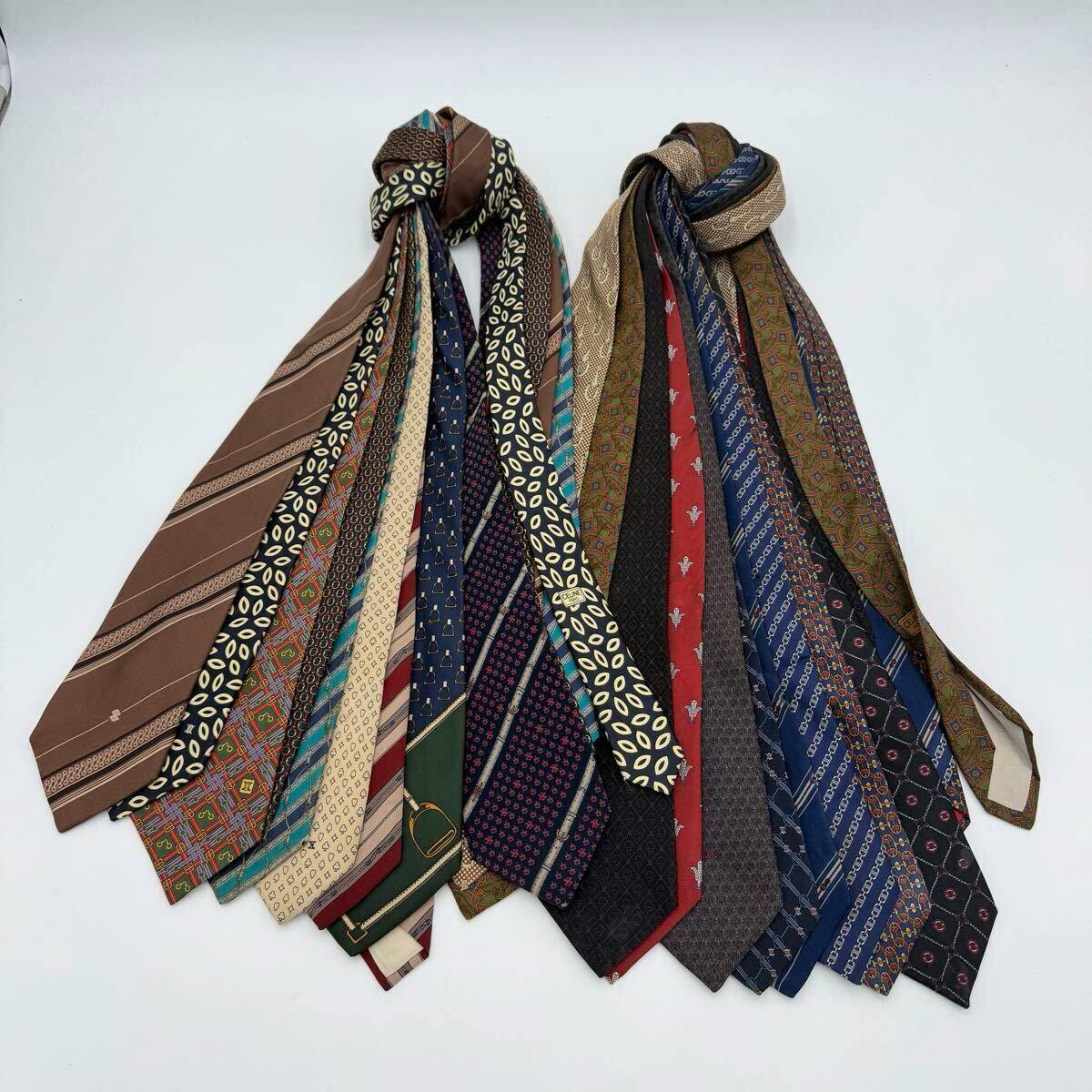 Multiple patterned CELINE men's silk neckties fanned out on a white background.