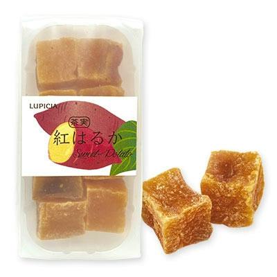 Packaged Ch'ami Beniharuka dried sweet potato cubes in a clear tray with two cubes shown beside the package.