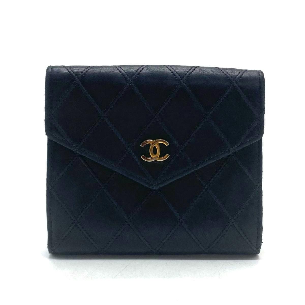Front view of the CHANEL leather bi-fold wallet showing quilted stitching and a gold CC logo.