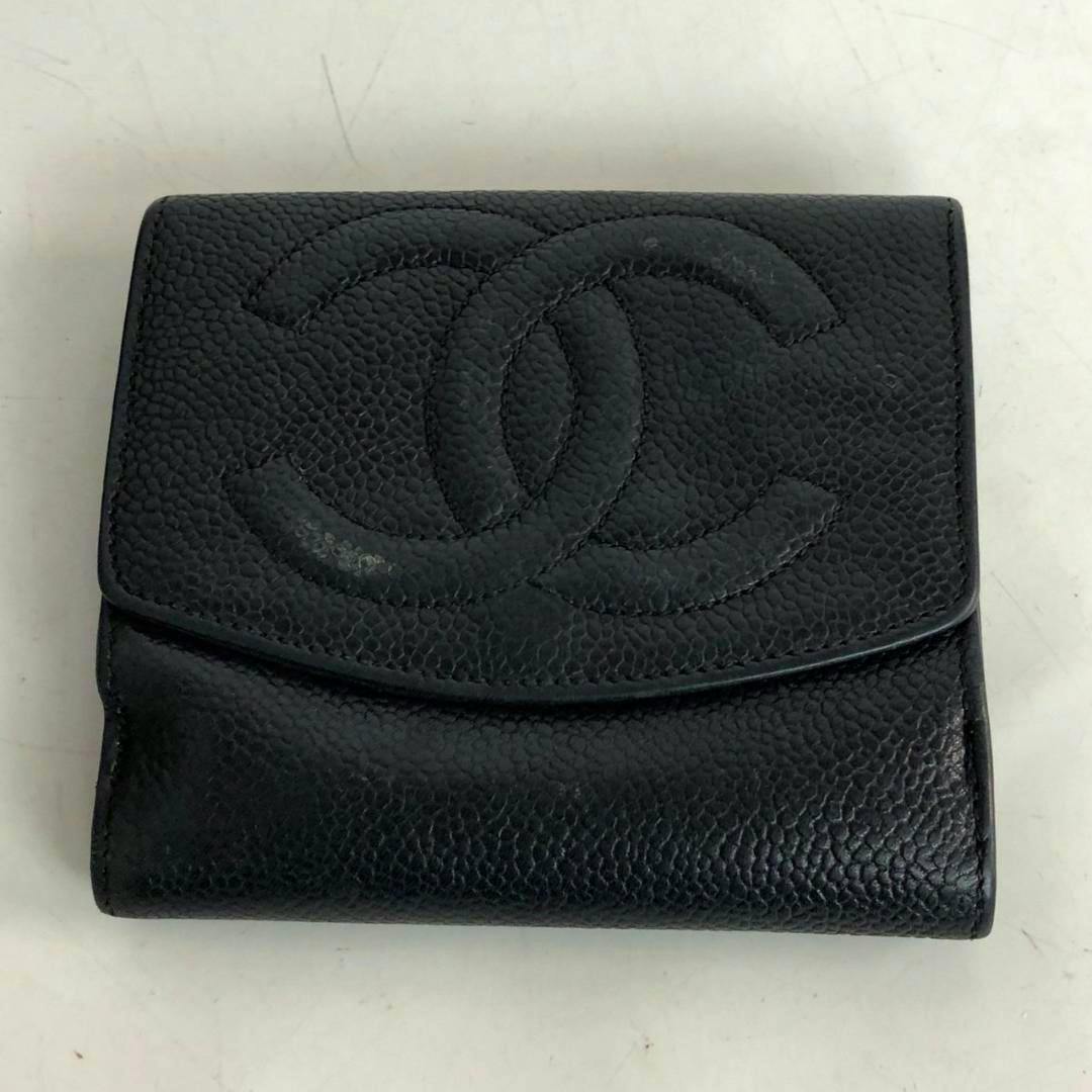 Black CHANEL caviar-skin bi-fold wallet showing the front flap with an embossed interlocking CC logo.