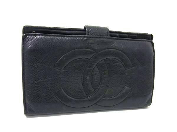 Black CHANEL caviar skin bi-fold long wallet showing an embossed interlocking CC logo on the front.