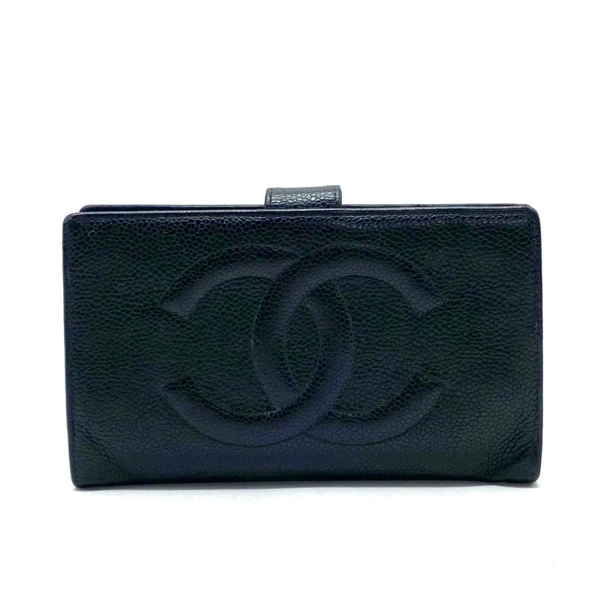 Front view of a black CHANEL caviar leather bifold long wallet with an embossed interlocking CC logo on the front.