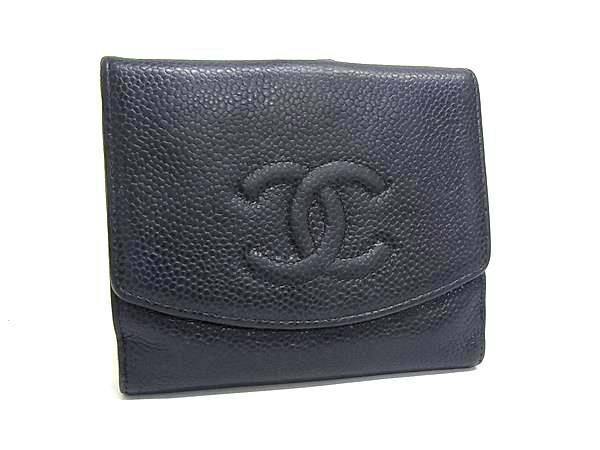 Front view of a black CHANEL caviar leather bi-fold wallet displaying an embossed interlocking CC logo.