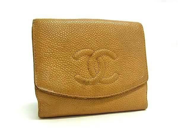 Beige CHANEL caviar cow leather bi-fold wallet showing the front with an embossed interlocking CC logo.