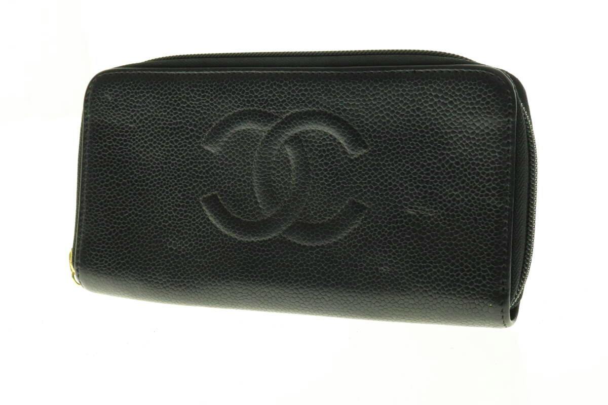 Black Chanel caviar leather long wallet with embossed interlocking CC on the front and a visible zipper.