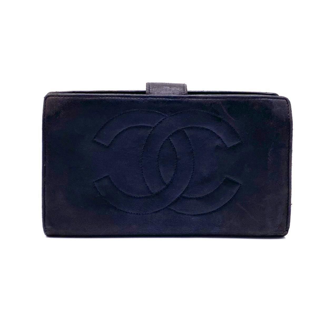 Front view of a black CHANEL long wallet showing an embossed interlocking CC logo.