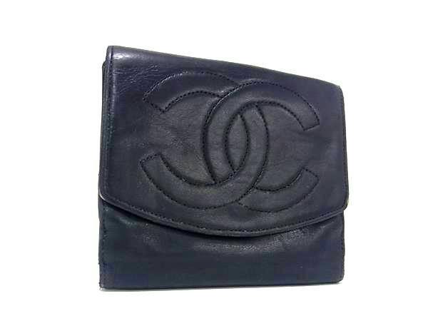 Front view of a black CHANEL lambskin bi-fold wallet showing a stitched interlocking CC logo.