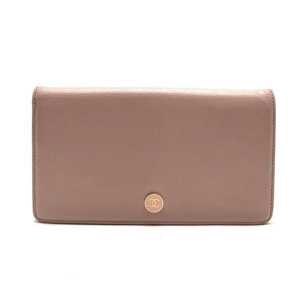 Pink cow leather CHANEL long wallet exterior showing the round gold CC logo near the bottom center.
