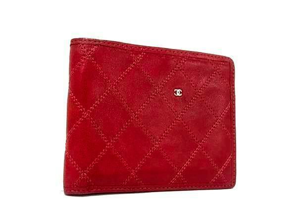 Red CHANEL matelassé bi-fold wallet showing the front with a small CC logo.