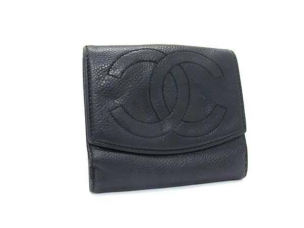 Black Chanel caviar leather bifold wallet with a large stitched CC logo on the front flap.