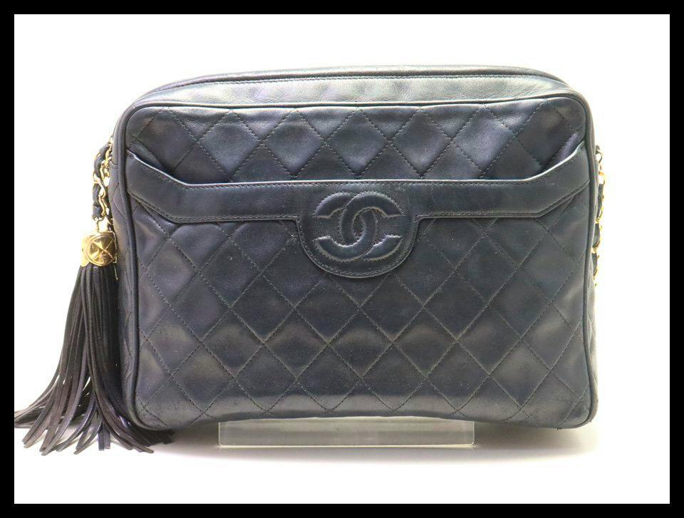 Front view of the CHANEL Matelassé lambskin shoulder bag showing quilted leather, interlocking CC logo, and a side tassel.