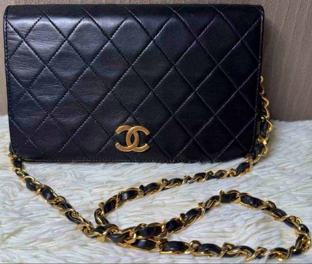 Front view of the CHANEL Matraisse lambskin single-chain shoulder bag in black showing the quilted exterior, gold CC logo, and chain-and-leather strap laid in front.
