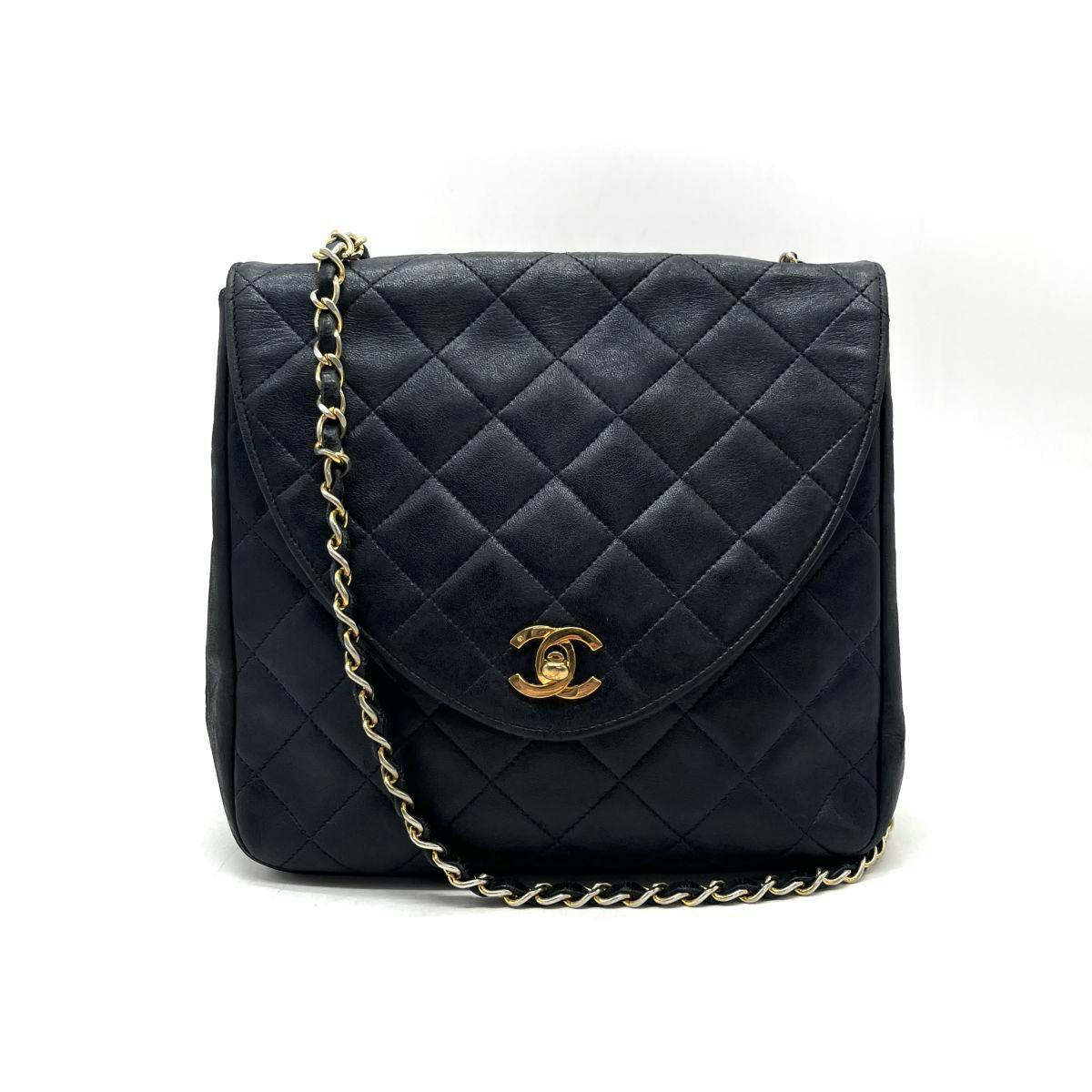 Front view of the matelassé lambskin chain shoulder bag showing quilted pattern, flap with gold turnlock Coco mark, and leather‑woven chain strap.