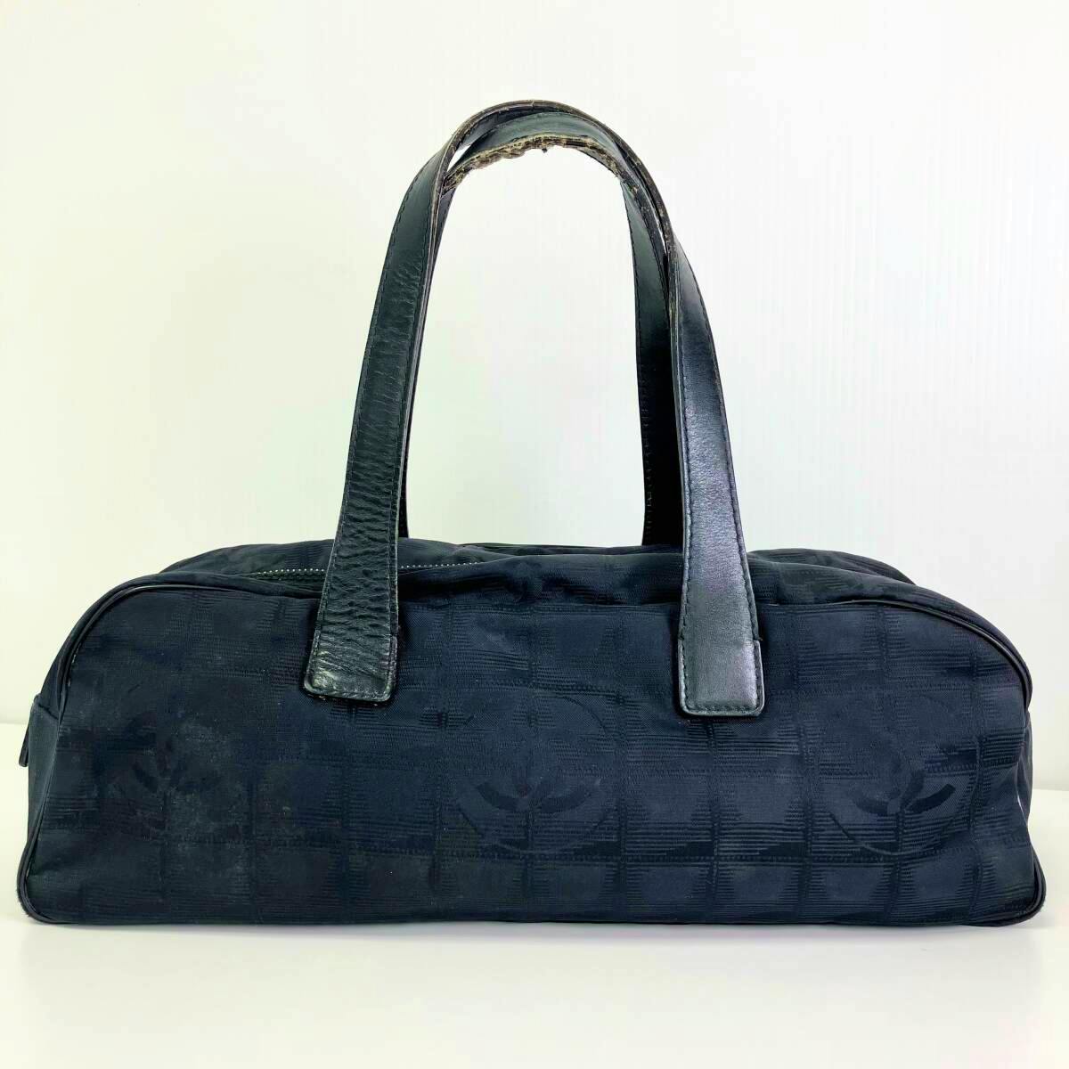 Black CHANEL nylon mini boston handbag shown from the front with two top handles visible.