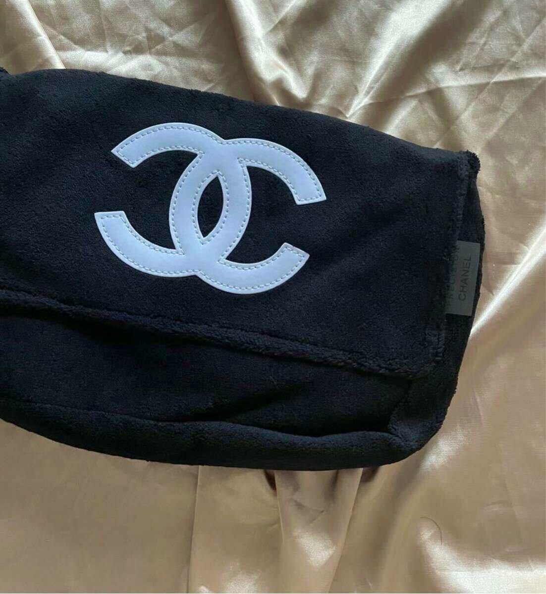 Black CHANEL messenger shoulder bag (canvas) with a white interlocking CC logo on the front flap.