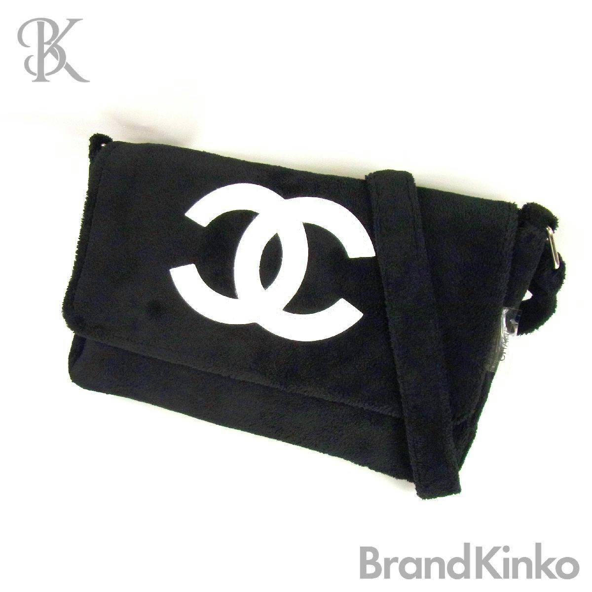 Black CHANEL pile-fabric shoulder bag with a large white interlocking CC logo on the flap shown on a white background.