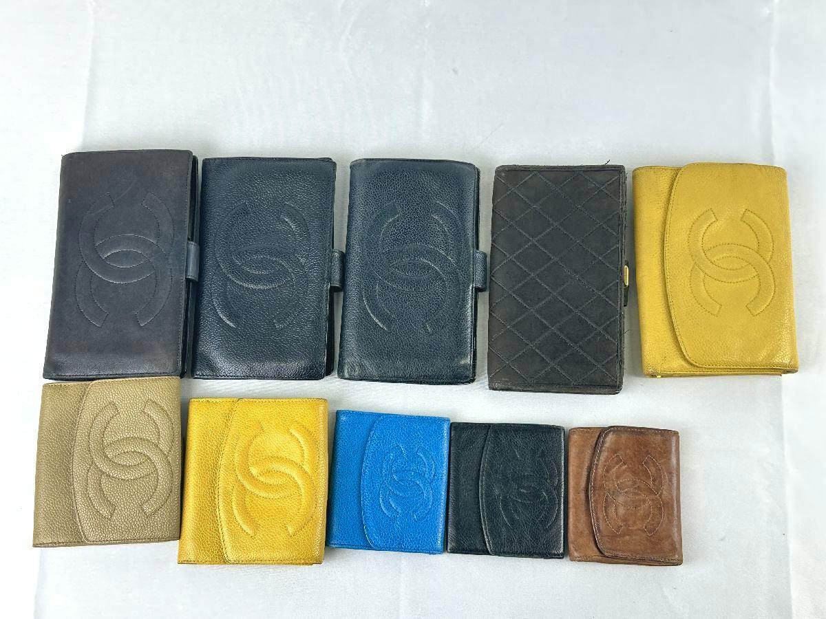 Ten CHANEL wallets in various colors arranged on a white background.