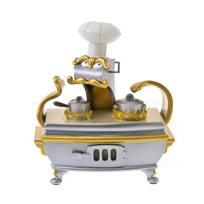 Front view of the Chef Bouche figure from Disney's Beauty and the Beast showing a silver-and-gold stove character with two pots and a chef's hat on a white background.