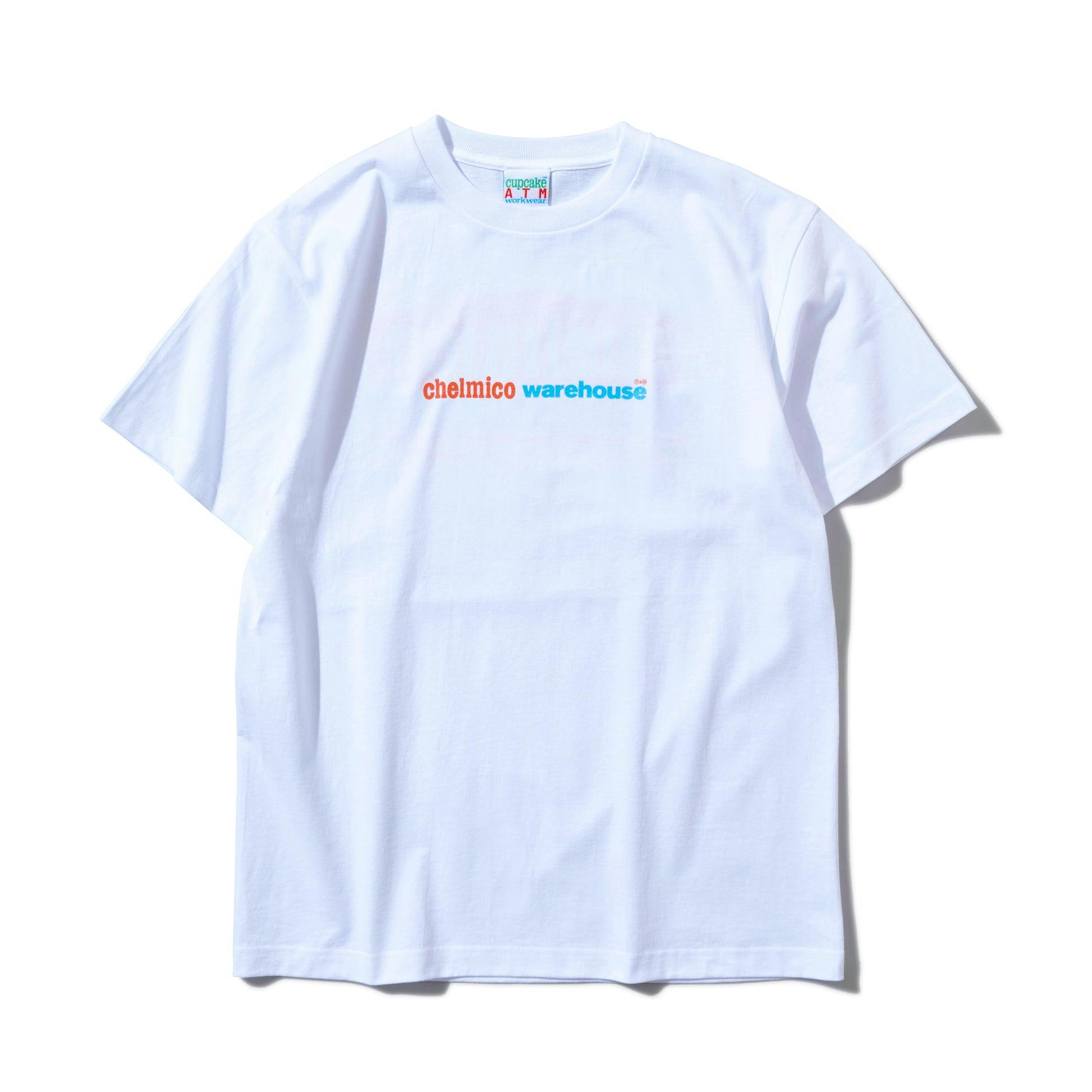 Close-up of the white chelmico warehouse Staff Tee showing the chest logo and crew neckline.