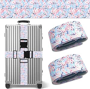 Two cherry blossom–patterned adjustable luggage straps shown beside a silver suitcase with one strap buckled around it.